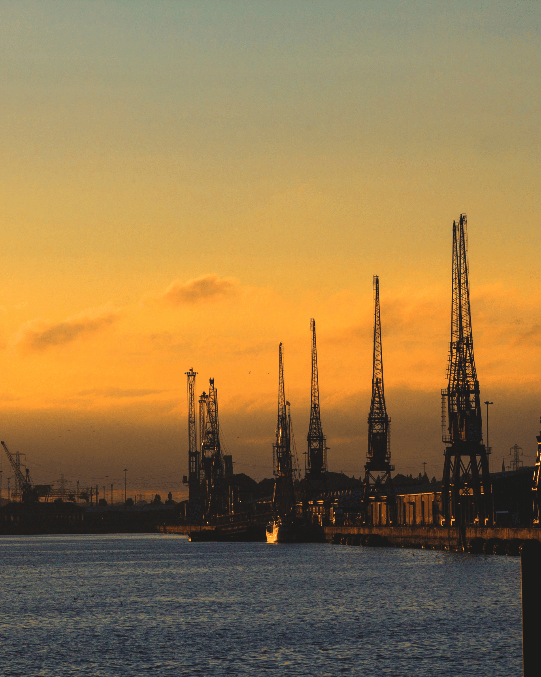 Dock cranes at sunset — St Leonards to Southampton cruise terminal transfers